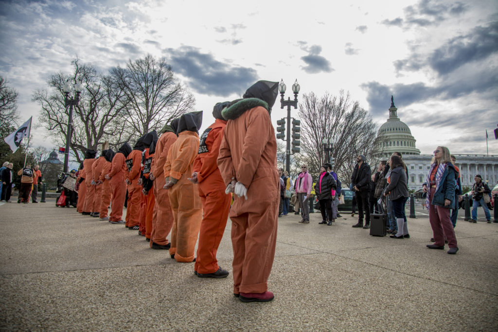 Protesters Dressed as Guantánamo Detainees Hold an Anti-Torture Demonstration on the 15th Anniversary of Guantánamo's Opening